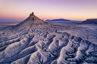 Sunset at Factory Butte in the Utah badlands.