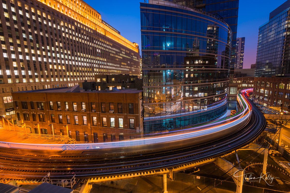 Around The Bend A long exposure captures this train on the elevated train platform at blue hour making its way around the Merchandise Mart