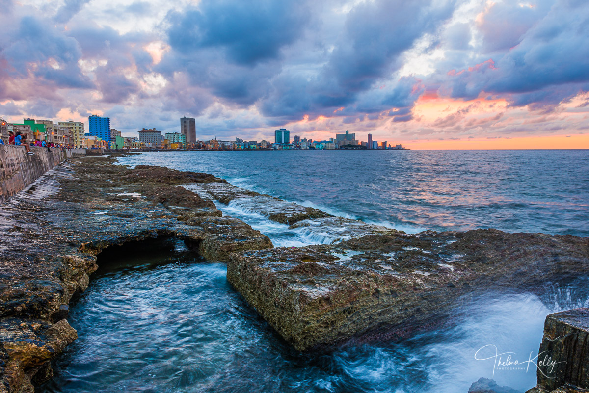 A Limited Edition of 50 Pedestrians enjoy strolling along El Malecón, Havana's seawall, which stretches for 5 miles along its...