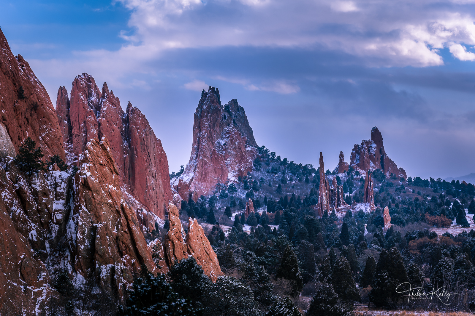 Piercing the sky of its surrounding landscape, the red, pink and white sandstone rock formations were created by intense forces...